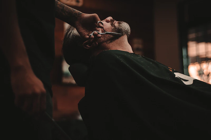 Client getting a fresh haircut at the barber chair