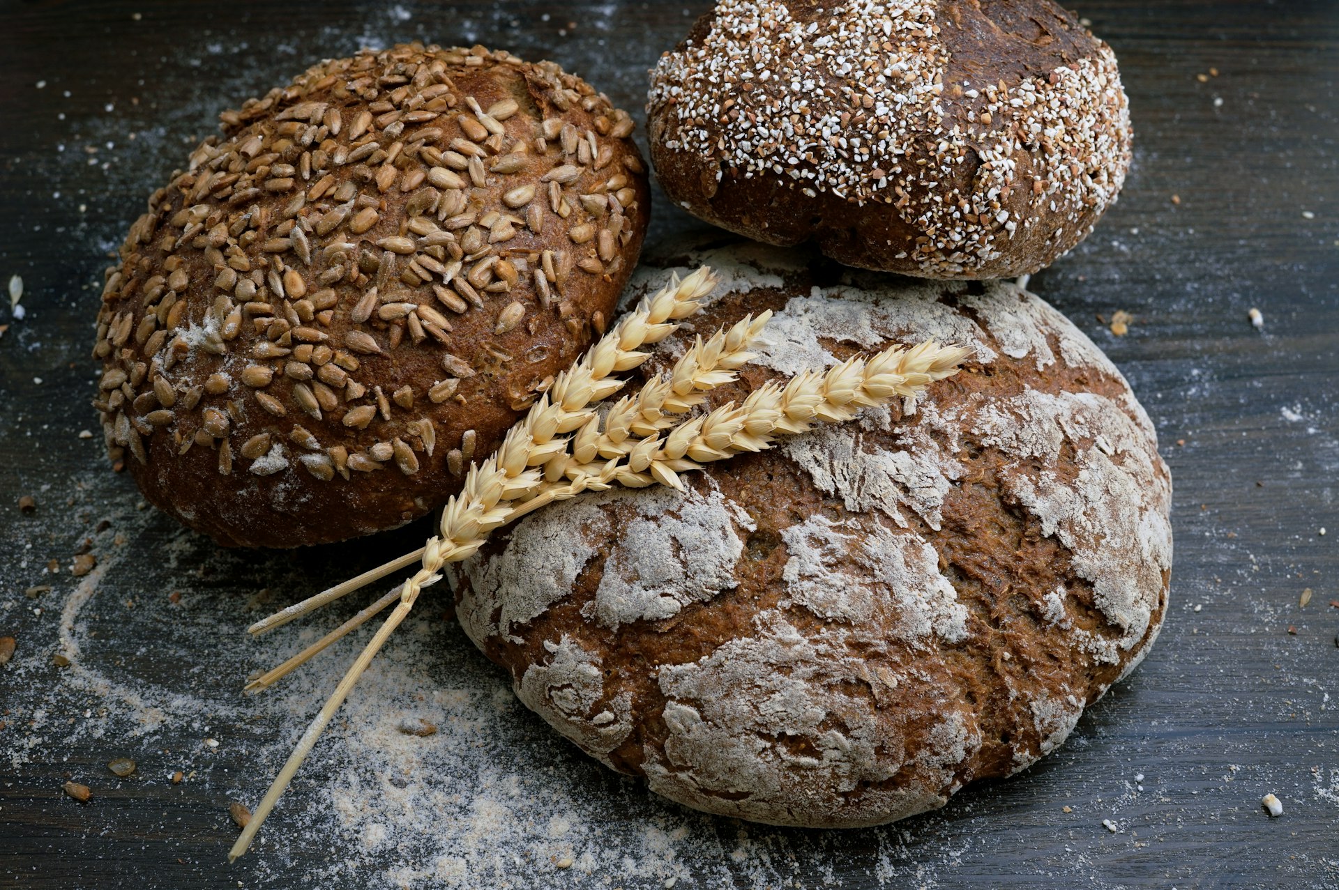 Fresh artisan bread pulled from the oven at Flour and Ember Bakehouse