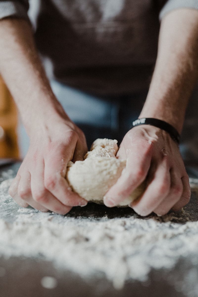 Hands kneading bread dough