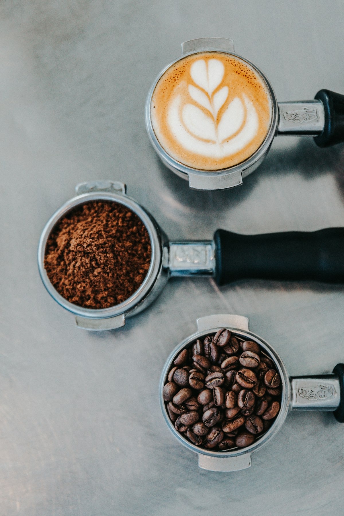 Freshly roasted coffee beans being poured from a bag into a cupping bowl