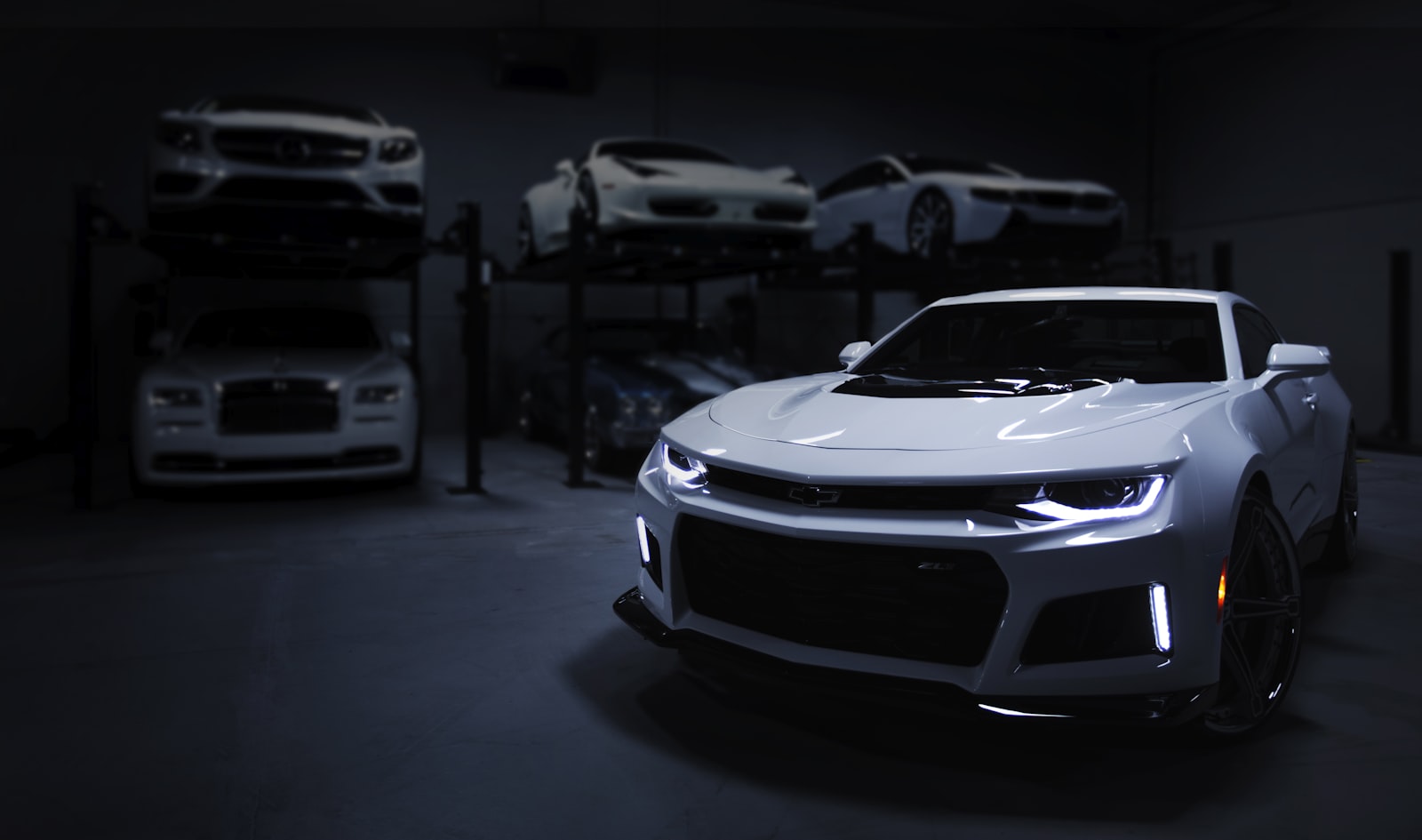 Performance car with a flawless dark finish under studio light