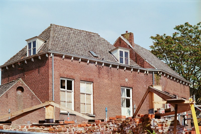 Large brick building with clock tower and classic facade