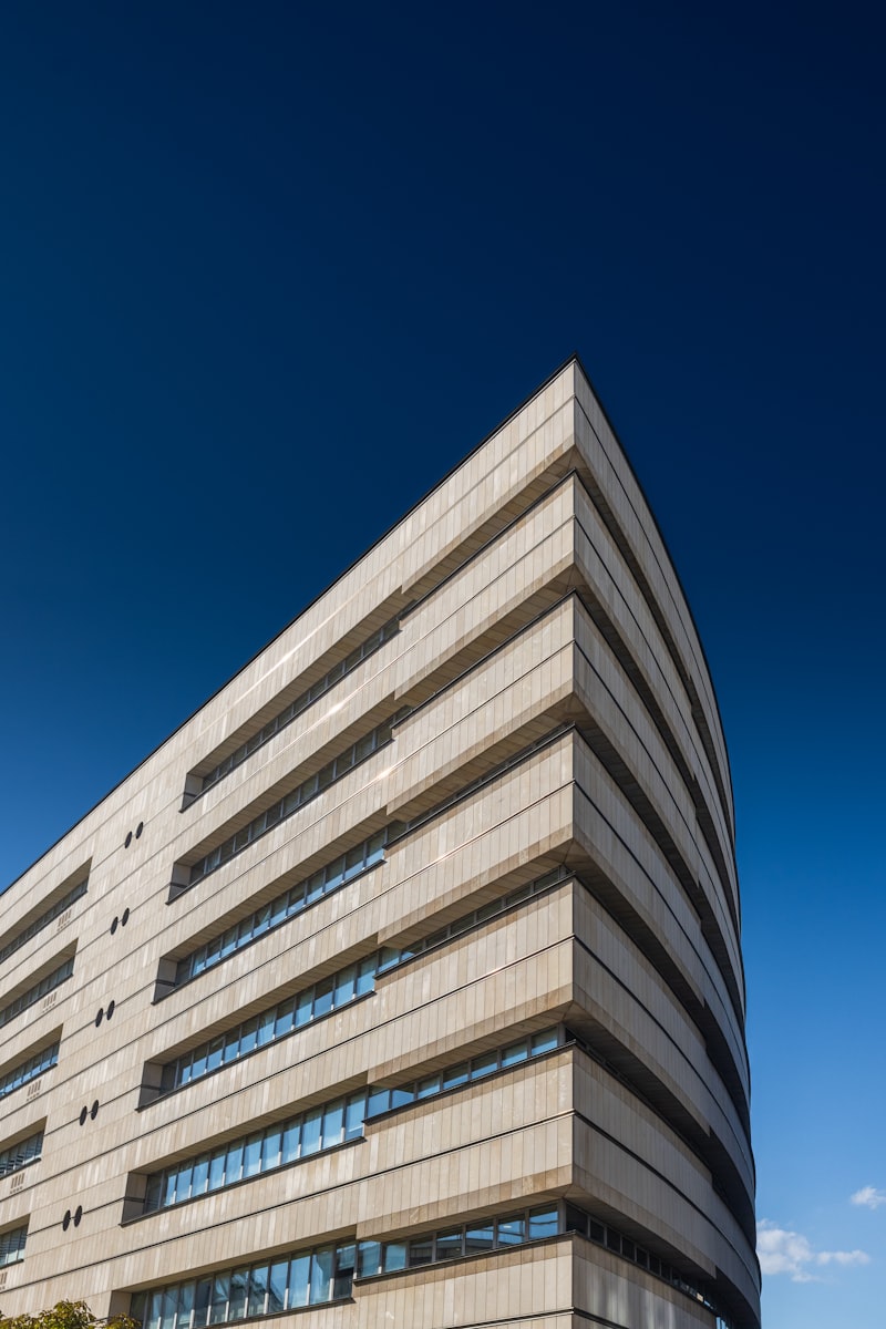 Modern building with curved facade and warm lighting